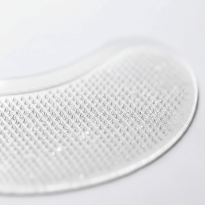 Macro close-up of the Bye Puff eye patch applicator
