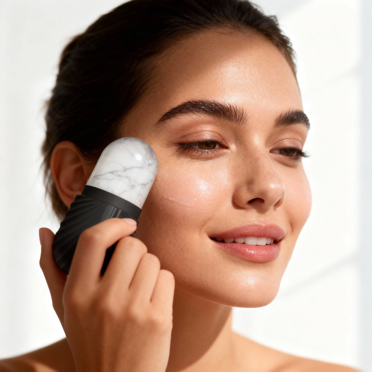 FrostGlow Ice Roller being used on the face